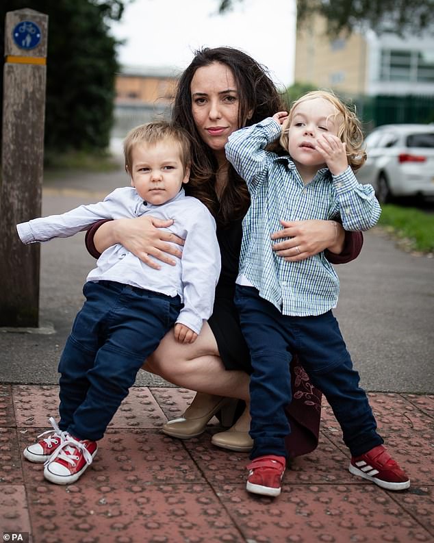 Stella Moris (center) and her sons, Gabriel (right) and Max (left) leave Belmarsh prison after visiting her partner and father, Julian Assange, in 2020.