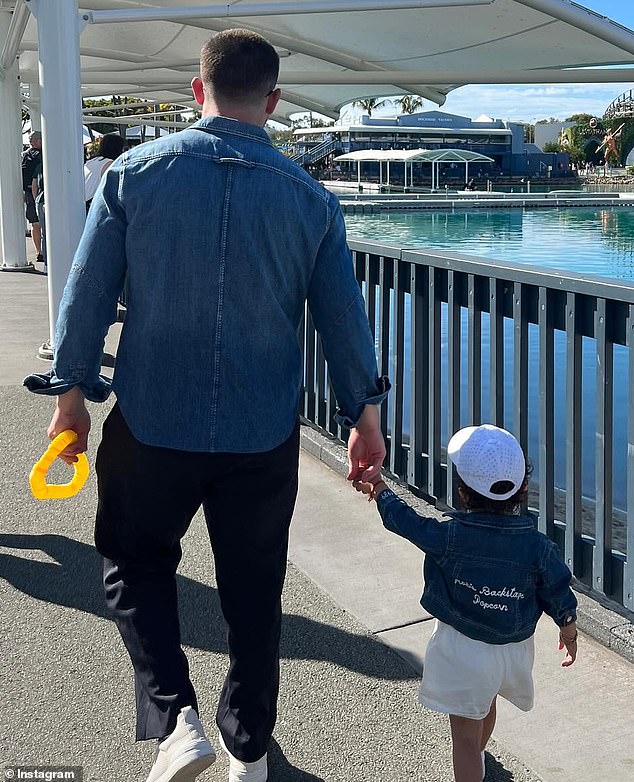 Jonas and Malti held hands and matched their jeans.