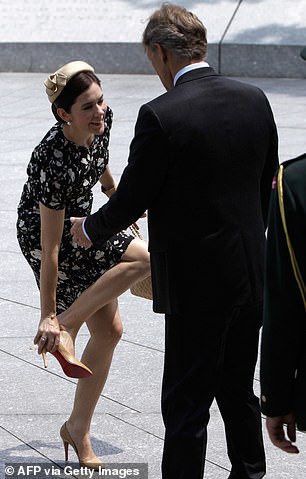 Mary seemed to laugh as she put the Christian Louboutin shoe on her foot.