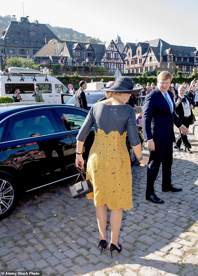 Queen Maxima of the Netherlands was left frozen after the heel of her left shoe broke before a boat trip in Oberwesel, Germany, in 2018.