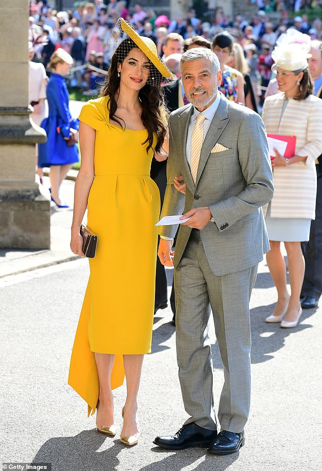 Amal and George Clooney arrive at St George's Chapel at Windsor Castle ahead of Prince Harry's wedding to Meghan in 2018