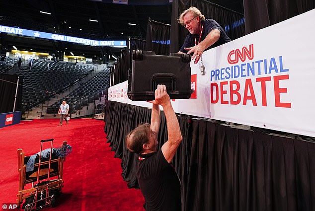 Bob Reilly, crew chief and videographer Chris Hanson, above, both of CSpan, prepared for the upcoming CNN presidential debate.