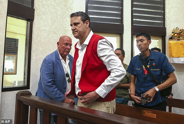 Australian Troy Smith is pictured in court in Bali, Indonesia, on Thursday. John McLeod is pictured on the left.