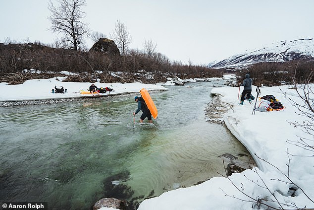 On the way to base camp, he crossed rivers and glaciers full of deadly crevasses. The image above shows Oli and his team passing through the Granite Creek River in Alaska.