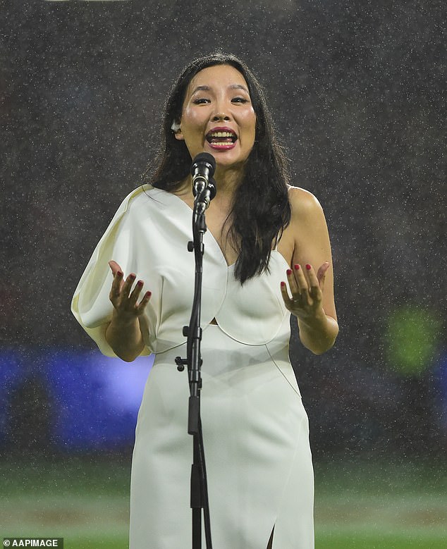 The X Factor winner looked every inch classy that night in a white dress that featured one-sleeved detailing and a scalloped bust line. She wore her long dark locks straight for the third set and added drama with a bold red lipstick and matching manicure.