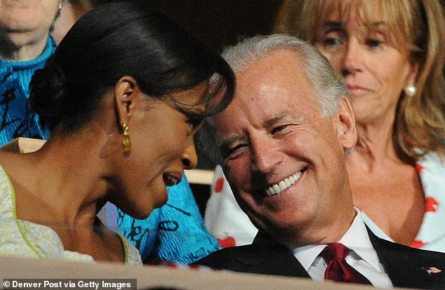 Joe Biden with Michelle Obama on the steps of the Pepsi Center during the second day of the Democratic National Convention on Tuesday, August 26, 2008 in Denver, Colorado