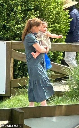 The 28-year-old's baby bump was previously visible beneath her flowy mid-length blue dress during a family day outing.