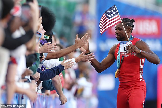 American fans high-five after winning the 100-meter final at the US Olympic Trials.