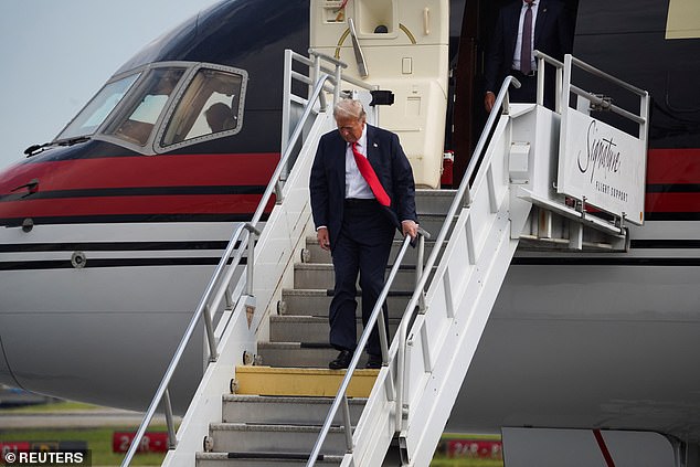 Donald Trump walks alone in Trump Force One when he arrived in Atlanta