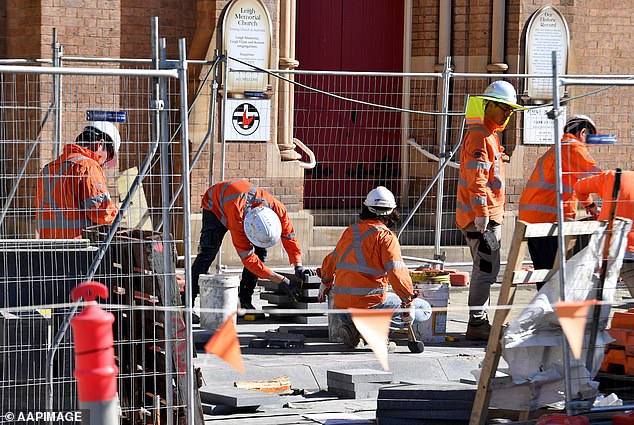 The Federal Government has set a target of building 1.2 million new homes over five years, equivalent to 240,000 each year (pictured are construction workers in Sydney)