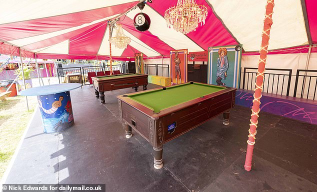 The Scissors tent includes pool tables as well as bright decorations.