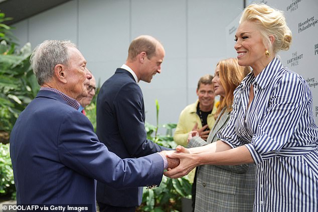 The feisty actress also responded to Mike Bloomberg, who mispronounced her name and instead introduced her as Hannah 'Wanningham' (pictured waving).