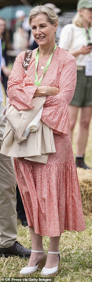 The mother-of-two looked the perfect English rose in her ankle-length dress, cream jacket and soft blonde hair pulled back into a relaxed bun.