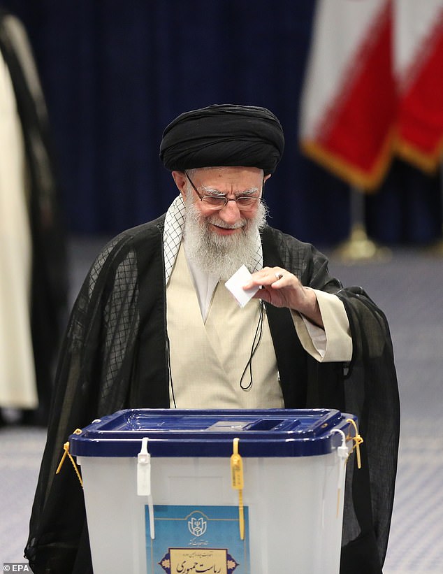 Iran's Supreme Leader Ayatollah Ali Khamenei speaks to the media after casting his vote during the presidential election in Tehran.