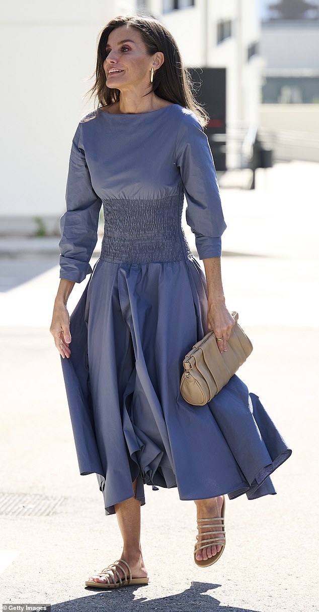 Queen Letizia looked radiant as she stepped out in a dark blue dress to attend a meeting at the Netflix headquarters in Spain