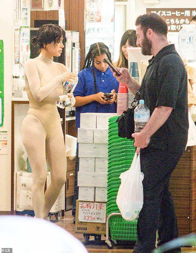 On the way to a supermarket in Japan with Kanye's eldest daughter North West and third child Chicago, six, Bianca donned a skin-tight, nude catsuit that showed off her underwear.