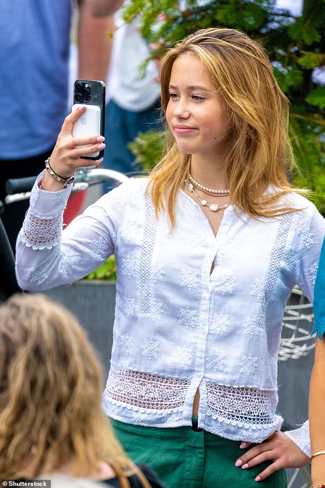 Crown Prince Christian's younger sister snapped a photo of her brother during the parade as she watched from the crowd.