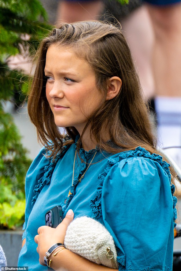 Princess Elizabeth wore a ruffled blue blouse as she attended the ceremony.