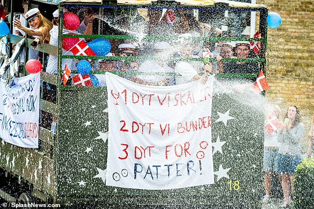 Let the party begin! Graduates blew bubbles from a cart while waving Danish flags, as is tradition at graduations in Denmark.