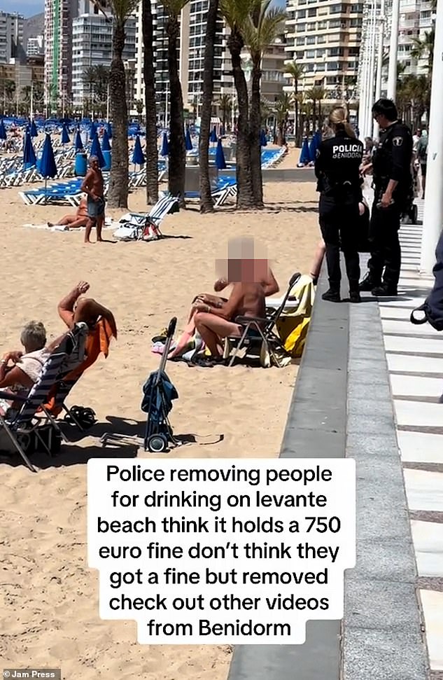 Police were filmed approaching the two men before allegedly asking them to leave. This comes as Benidorm introduces a raft of fines to curb tourists, including an alcohol ban that could cost up to £635