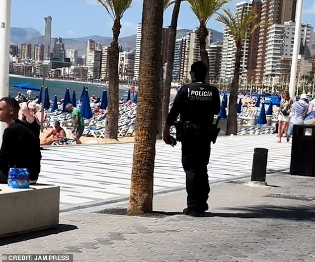 Police were seen patrolling along the promenade near Benidorm beach.