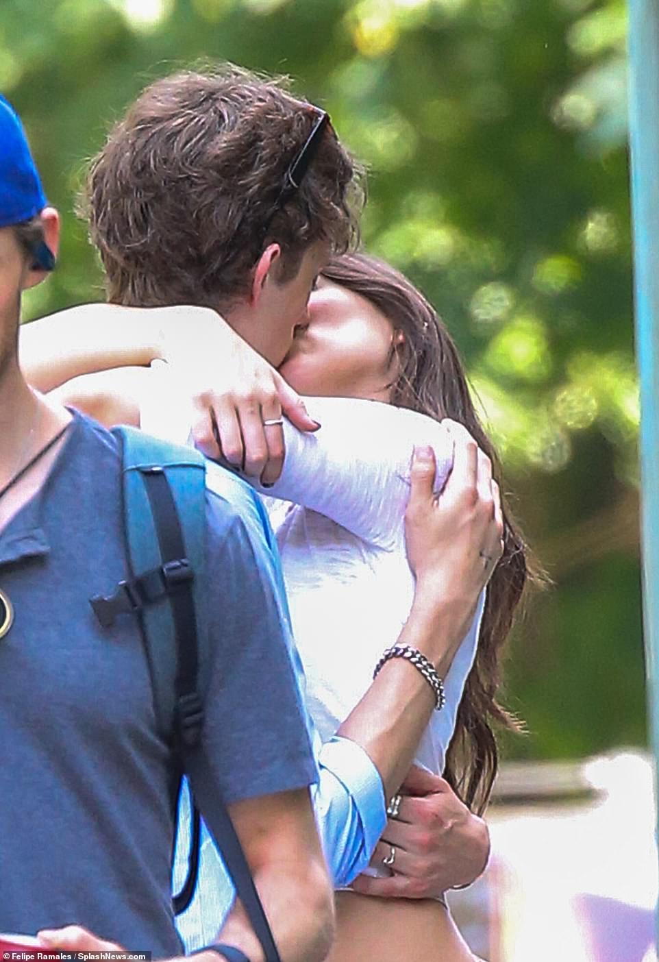 The teenage couple were spotted kissing on the street during the day.