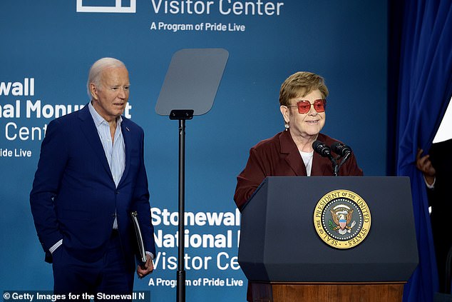 Elton John and President Joe Biden speak on stage during the dedication ceremony for the Stonewall National Monument Visitor Center