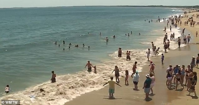 Maine officials are sounding the alarm about dangers at Old Orchard Beach (pictured), such as rip currents and erosion hazards.