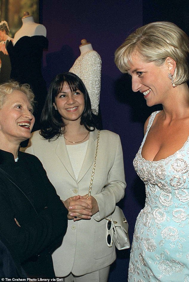 Princess Diana speaking with the designer who created the revenge dress, Christina Stambolian (in black jacket)