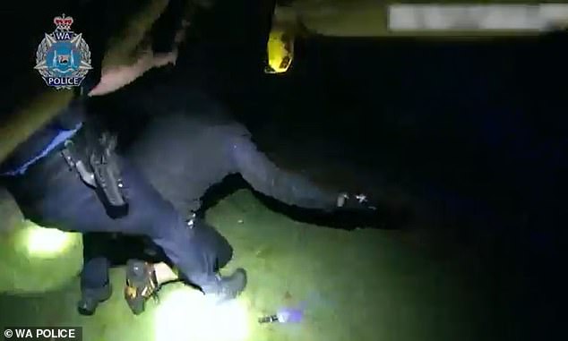 After a second officer arrived, the two pinned the suspect (pictured) to the ground.