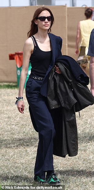 TV presenter Alexa, 40, covered her modesty with navy trousers and held on to her coat, despite the warm weather.