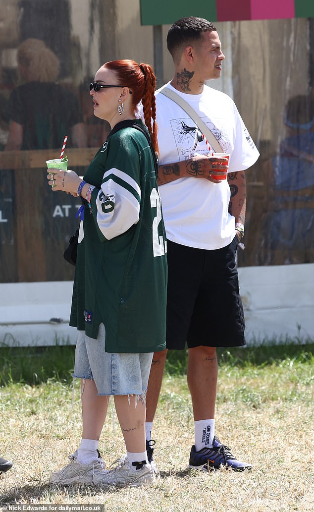 Anne-Marie wore baggy denim shirts and an oversized green sports top, while Slowthai looked trendy in a white graphic T-shirt and black shorts.