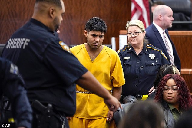 Johan José Martínez-Rangel, one of two men accused of killing 12-year-old Jocelyn Nungaray, is led out of the courtroom by officers on Tuesday.