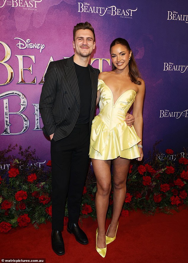 The former Miss Universe Australia had her handsome boyfriend on her arm at the Beauty and the Beast premiere in Melbourne on Saturday. The beauty queen couldn't wipe the smile off her face as she hugged the handsome mystery man.