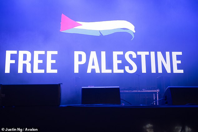 A message of support for the Palestinians and condemnation of Israel is projected on the screen on the Woodsies stage at the 2024 Glastonbury Festival.