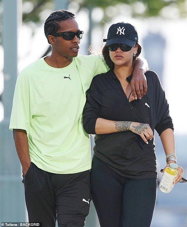 The 36-year-old Fenty mogul was spotted enjoying a sweet moment with the father of her two children while out for a walk on Thursday morning.