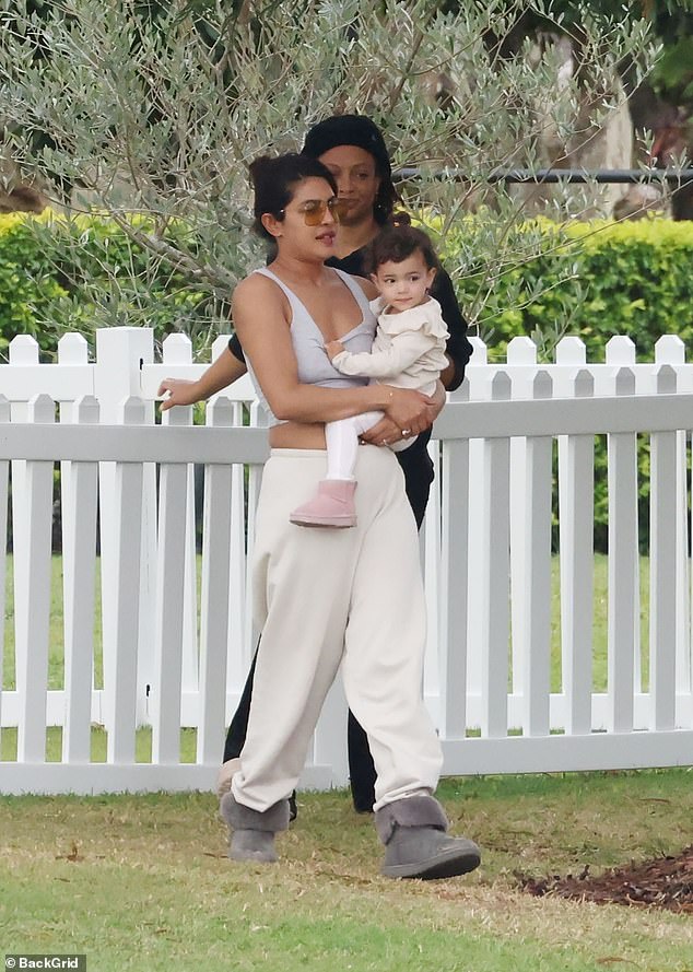 While cradling her adorable daughter, Malti Marie, Priyanka looked every bit the doting mother.