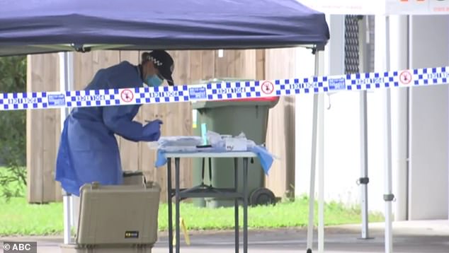 Police were seen searching a nearby house for evidence (pictured) as the accused, Floyd Tomarra, recovers from his injuries in hospital before facing court charged with murder.