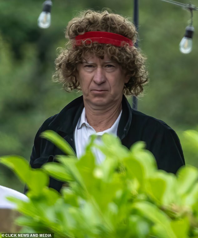 Her signature hairstyle returned in the form of a wig with a red headband on top, along with white shorts and a polo shirt.