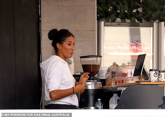 Australia's 2.7 million lowest-paid workers will receive a 3.75 per cent pay rise on Monday, increasing their hourly wage by $24.10 and taking their weekly pay to $915.90 (pictured, a barista in Parramatta, Sydney)