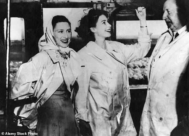 Princess Elizabeth (right) with her sister Princess Margaret on the royal train in South Africa