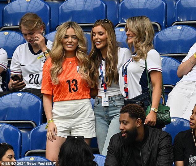 Georgina Irwin, wife of Dean Henderson, and Aine May Kennedy, partner of Conor Gallagher, posed together before the match