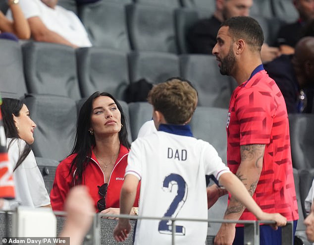 Kyle with his wife Annie Kilner and one of their children after last Thursday's game.