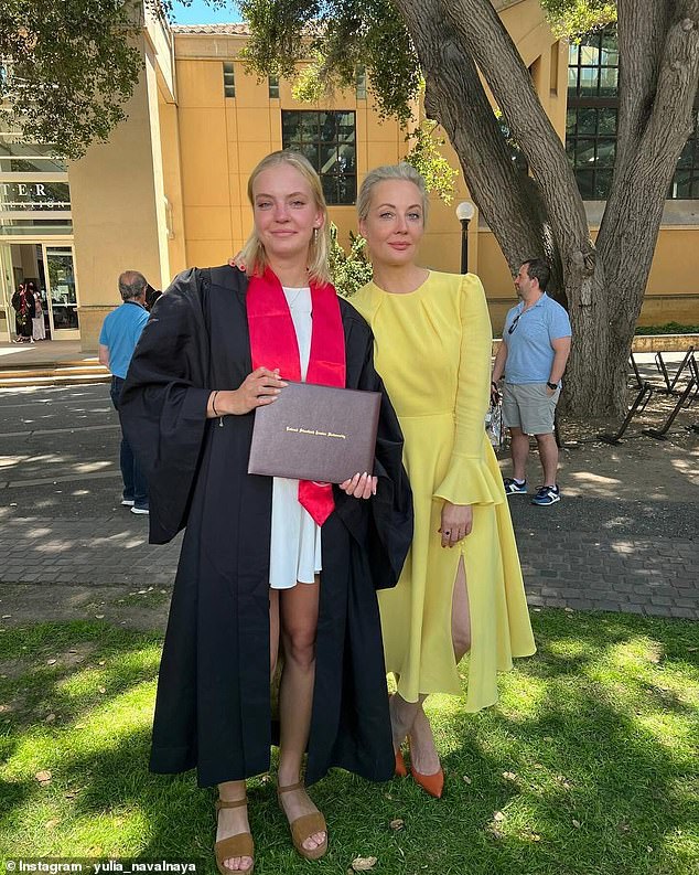 Dasha and her beaming mother Yulia pose together on Dasha's graduation day on Sunday.