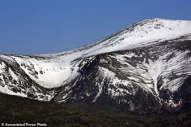 FILE - Tuckerman Ravine is seen at left, about a mile below the summit of 6,288-foot Mount Washington in New Hampshire.