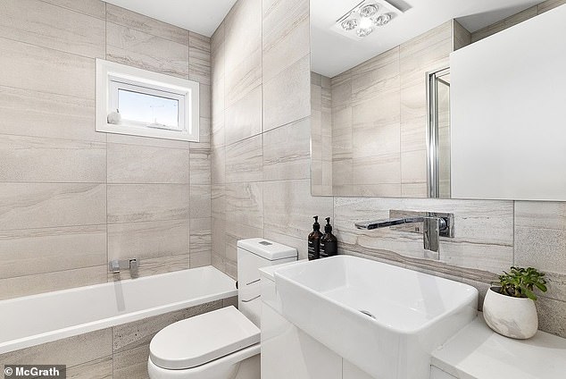 The master bathroom, meanwhile, offers a separate tub and shower.