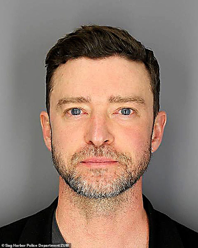 Martini musician Justin Timberlake's eyes were redder than Satan's fly in an infamous mug shot taken after he was charged Tuesday with drunk driving.