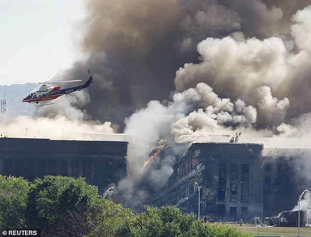 A rescue helicopter flies over the Pentagon just after the plane hit the building.