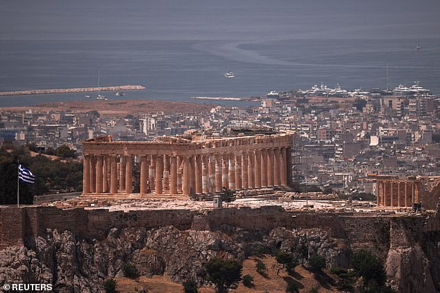 Above, a closer look at the current Parthenon, located atop the Acropolis in Athens, Greece.