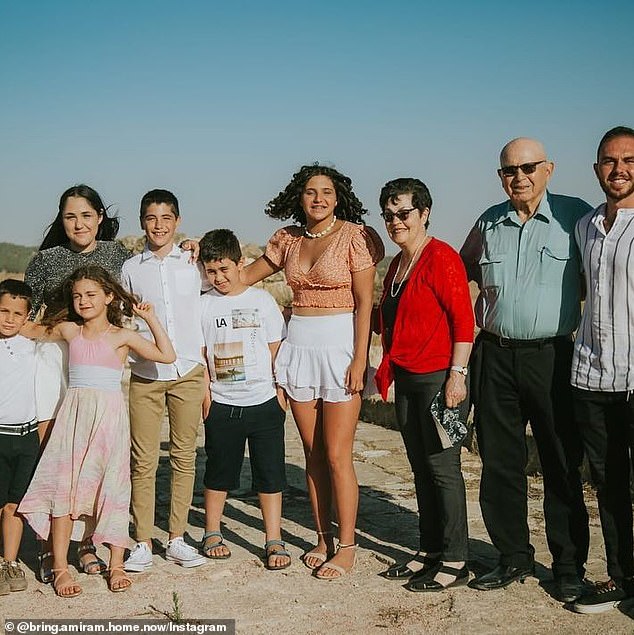 Amiram Cooper (second from right) and Nurit Cooper (red shirt) pictured with their family.